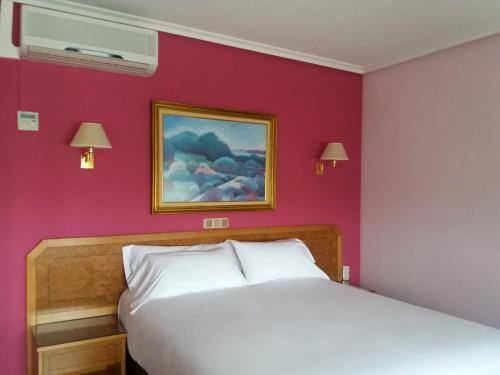 Postel nebo postele na pokoji v ubytování Hotel Don Carmelo