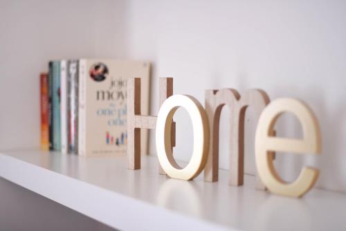 a book shelf with the word fiction written in letters at Cosy Luxury Apartment - Lisbon Center in Lisbon