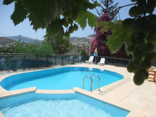 a swimming pool in a villa with a view at Enda Boutique Hotel Kalkan in Kalkan