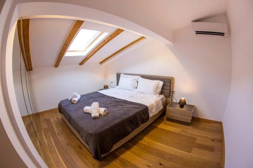 Krevet ili kreveti u jedinici u okviru objekta Porto Apartmani