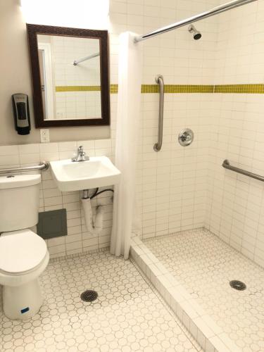 a bathroom with a toilet and a sink and a shower at Bay Hotel in San Francisco