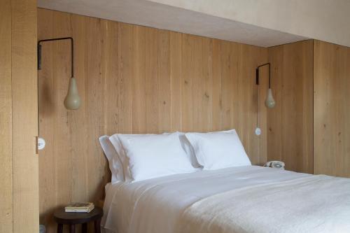 En eller flere senger på et rom på Quinta da Côrte