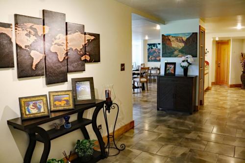 a hallway with paintings on the wall at Sheridan House Inn- Adult Only Accommodation in Williams