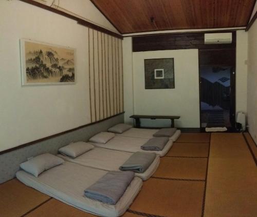 Postel nebo postele na pokoji v ubytování Bright Moon Homestay