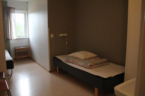 Postel nebo postele na pokoji v ubytování Sälens Vandrarhem i Gräsheden