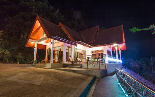 a house lit up at night with lights at Krabi Villa Phu Khao Private Resort in Klong Muang Beach