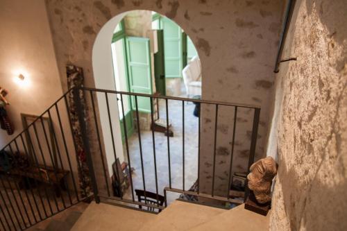 an entrance to a building with a spiral staircase at Resort Fontes Episcopi in Aragona