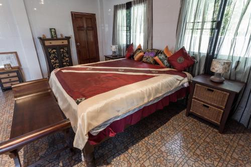 a bedroom with a large bed in a room at Krabi Villa Phu Khao Private Resort in Klong Muang Beach