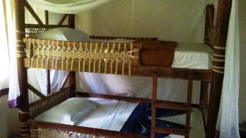 a couple of bunk beds in a room at Bahari Pori Resort in Pangani