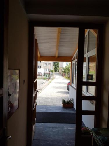 an open door of a house with a porch at Penzion Eden Turnov in Turnov