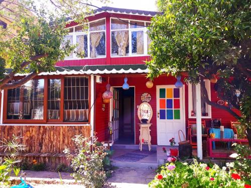 a red house with a colorful front door at Side Tuana Garden Home in Side