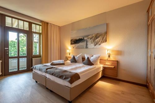 Ένα ή περισσότερα κρεβάτια σε δωμάτιο στο Hotel Villa Halliger