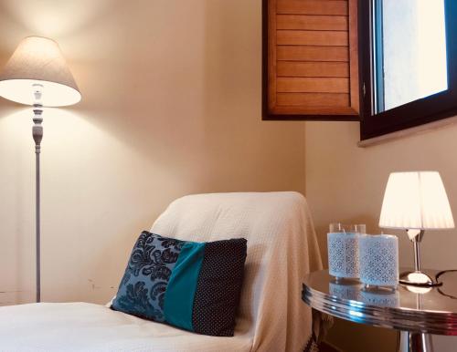 a room with a bed and a table with a pillow at Green Park Hotel & Residence in Bagnara Calabra