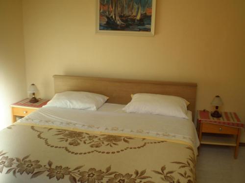Posteľ alebo postele v izbe v ubytovaní Tivoli Apartment