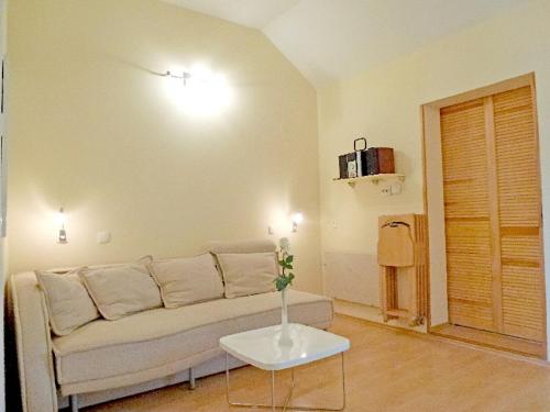 a living room with a couch and a table at Apartments Mladen in Njivice