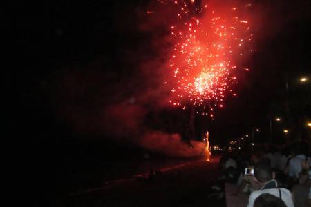 a firework display on a city street at night at Pietra di mare in SantʼAgata di Militello
