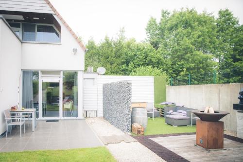 Ein Garten an der Unterkunft Vakantiewoning Hakuna Matata