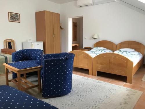 Postel nebo postele na pokoji v ubytování Silvanus Panzió