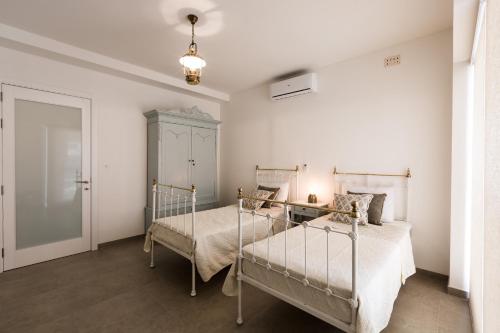 Llit o llits en una habitació de Ta Martin, Flat 2