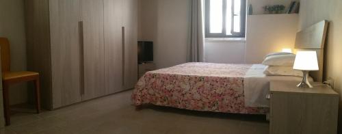 En eller flere senger på et rom på La Dimora del Borgo