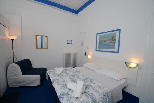 Postel nebo postele na pokoji v ubytování Olympia Hotel