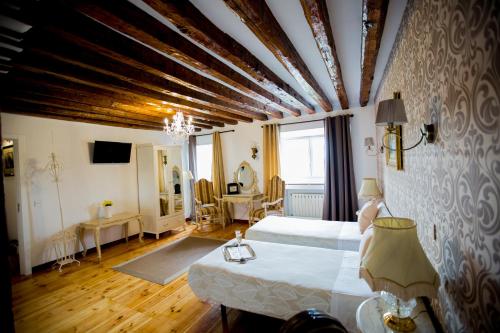a large room with a bed and a large window at Oriente Palace Apartments in Madrid