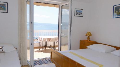 Postel nebo postele na pokoji v ubytování Beach front apartments Balica Rat