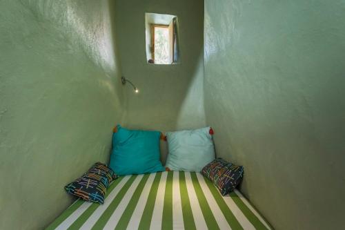 Кровать или кровати в номере Traditional Farmers Caves