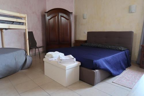 a bedroom with a bed and a bunk bed at S'arriali Ranch in Iglesias