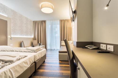 En eller flere senger på et rom på Hotel Gardesana