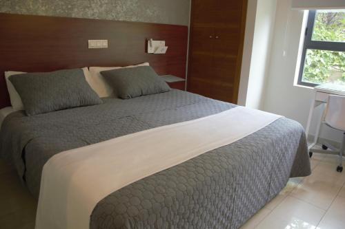 Un ou plusieurs lits dans un hébergement de l'établissement Hotel Vista al Sol