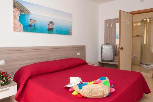 Ένα ή περισσότερα κρεβάτια σε δωμάτιο στο Albergo San Giorgio