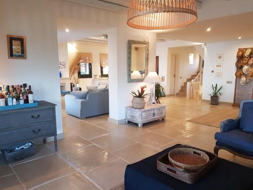 a living room with a couch and a table at Therme Sea Luxury Lodge in Thermisia