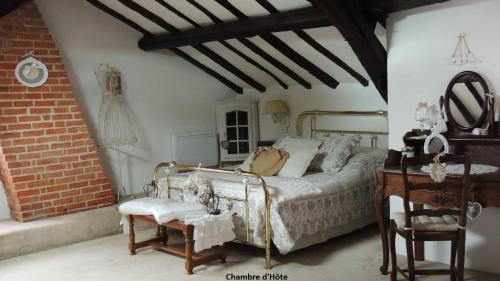 En eller flere senge i et værelse på Moulin de la Placette
