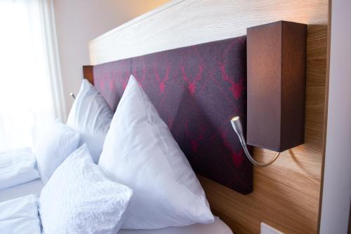 Кровать или кровати в номере Wellnesshotel Zum Koch