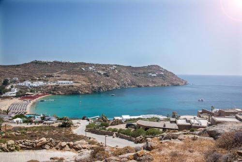 a view of a beach with a body of water at Etesians Suites & Villas in Super Paradise Beach