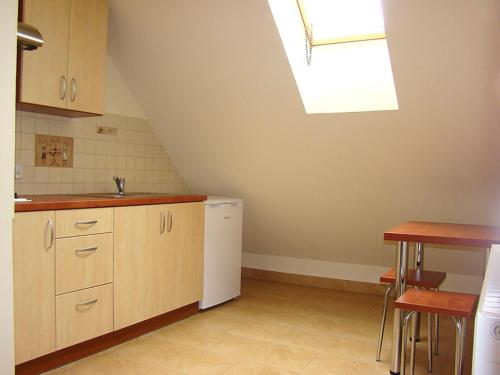 Kuchyňa alebo kuchynka v ubytovaní Apartamenty Pod Lipami