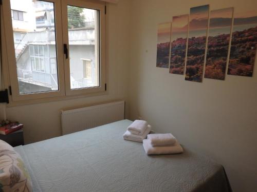 Un pat sau paturi într-o cameră la Lion Apartment Sunset