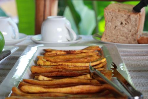 a plate of food on a table with bread at Casa de Palos Boutique in Tarapoto
