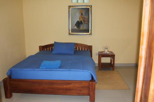 Кровать или кровати в номере Tegal Jero Homestay