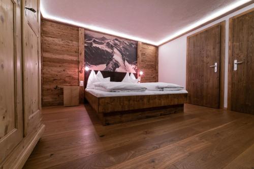 Una cama o camas en una habitación de Chalet Alpin