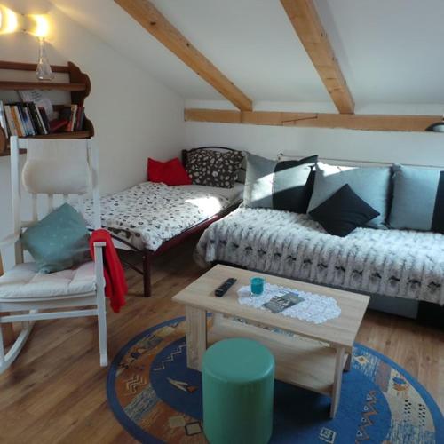 a living room with a couch and a table at Jankoviceva cesta 19 in Matulji