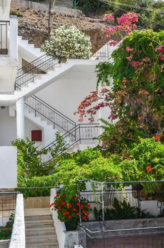 a group of stairs with flowers and plants at Kalypso in Agia Galini