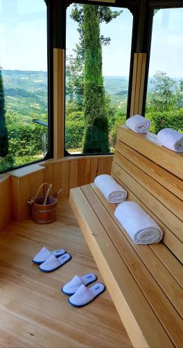a room with two wooden shelves with flip flops at La Ribezza Boutique Hotel in Monforte dʼAlba