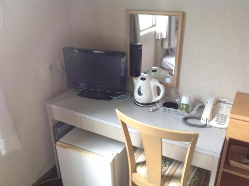 Příslušenství pro přípravu čaje a kávy v ubytování Hotel Hinodeya