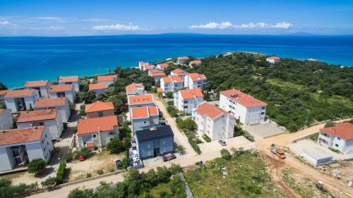 an aerial view of a village by the ocean at Villa Ave in Novalja