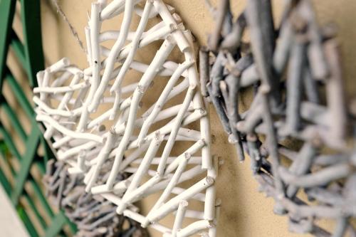 a bunch of white wires hanging on a wall at Carslogie House in Port Elizabeth