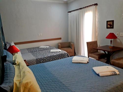 Katil atau katil-katil dalam bilik di Hotel Pousada Oasis Park
