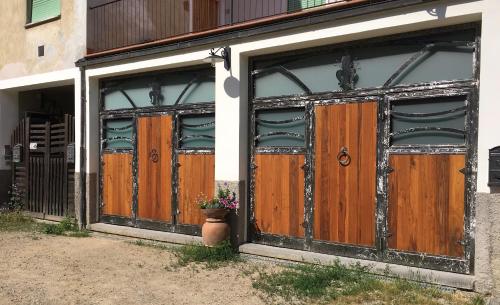 a pair of wooden doors on a building at Villa Baronzola in Montevarchi