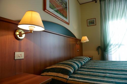 A bed or beds in a room at Agriturismo il Cascinale